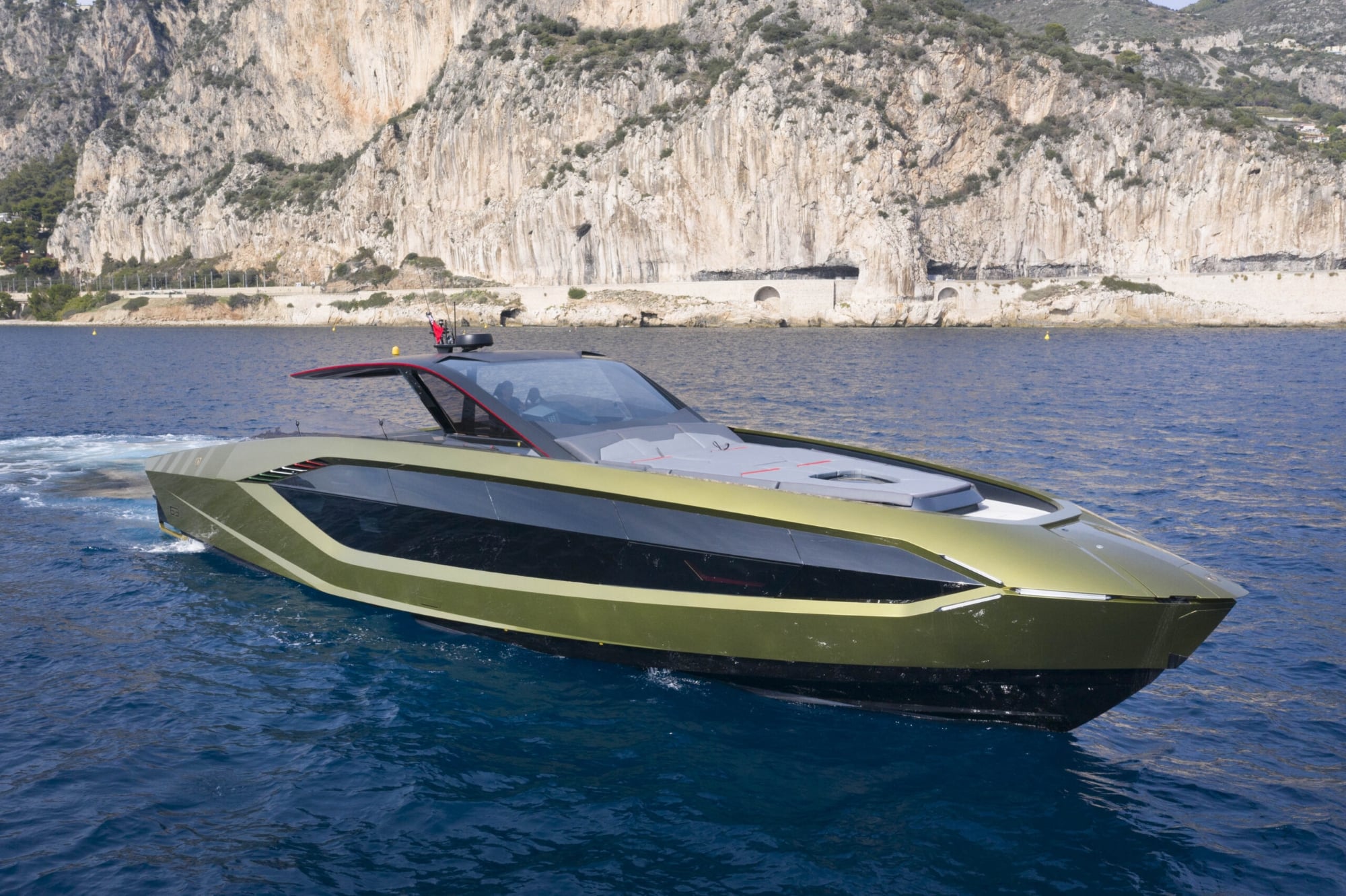 Performance yacht cruising along the coast